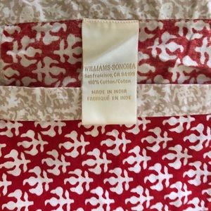 Williams Sonoma Xmas red and creams tablecloth.